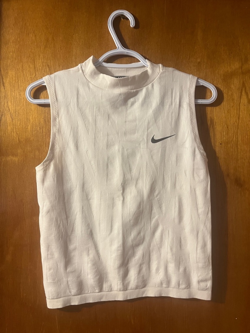 Woman’s Nike White Sleeveless Tank with Gray Swoosh Design on Back Small